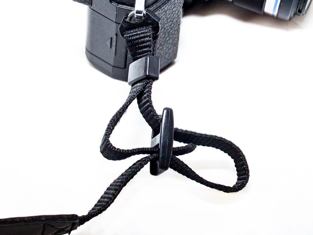 Feeding the camera strap back into the buckle