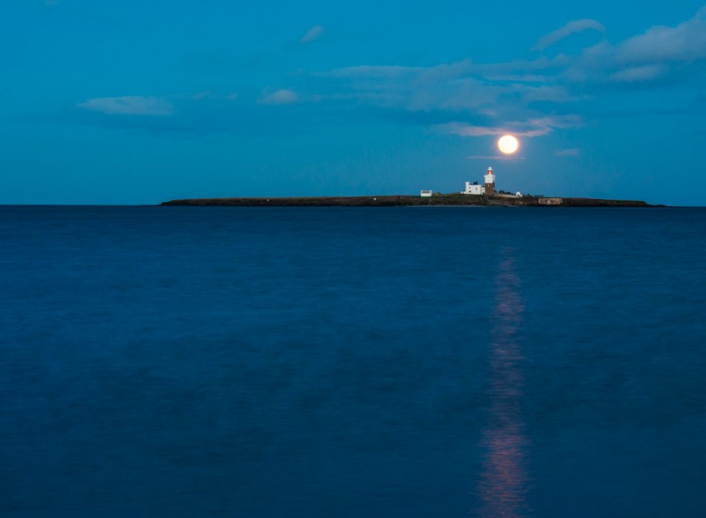 Moonrise over Coquet Island during the blue hour