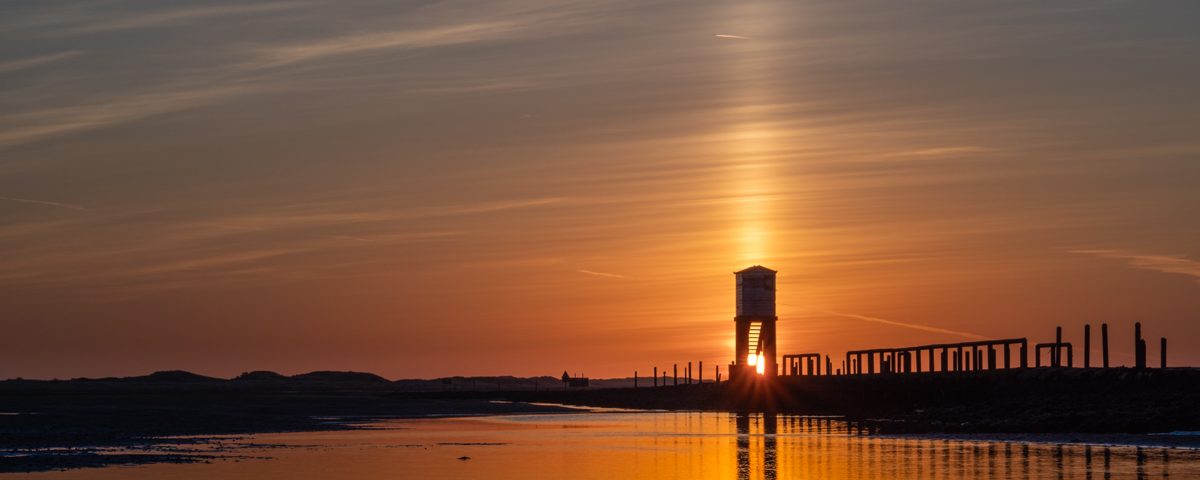 Buying lenses - Sunrise over Lindisfarne Causeway shot with a vintage lens