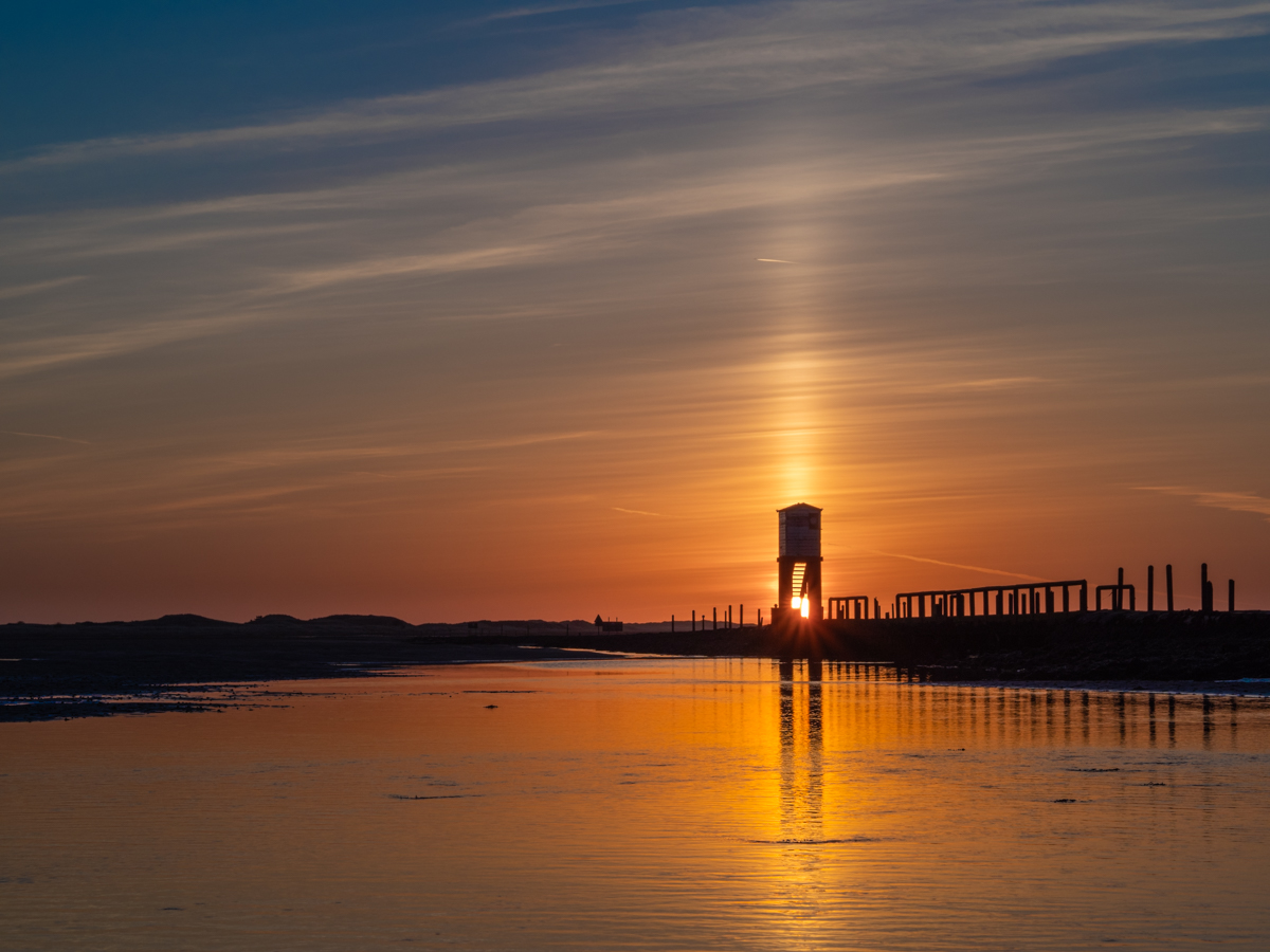 Buying lenses - Sunrise over Lindisfarne Causeway shot with a vintage lens