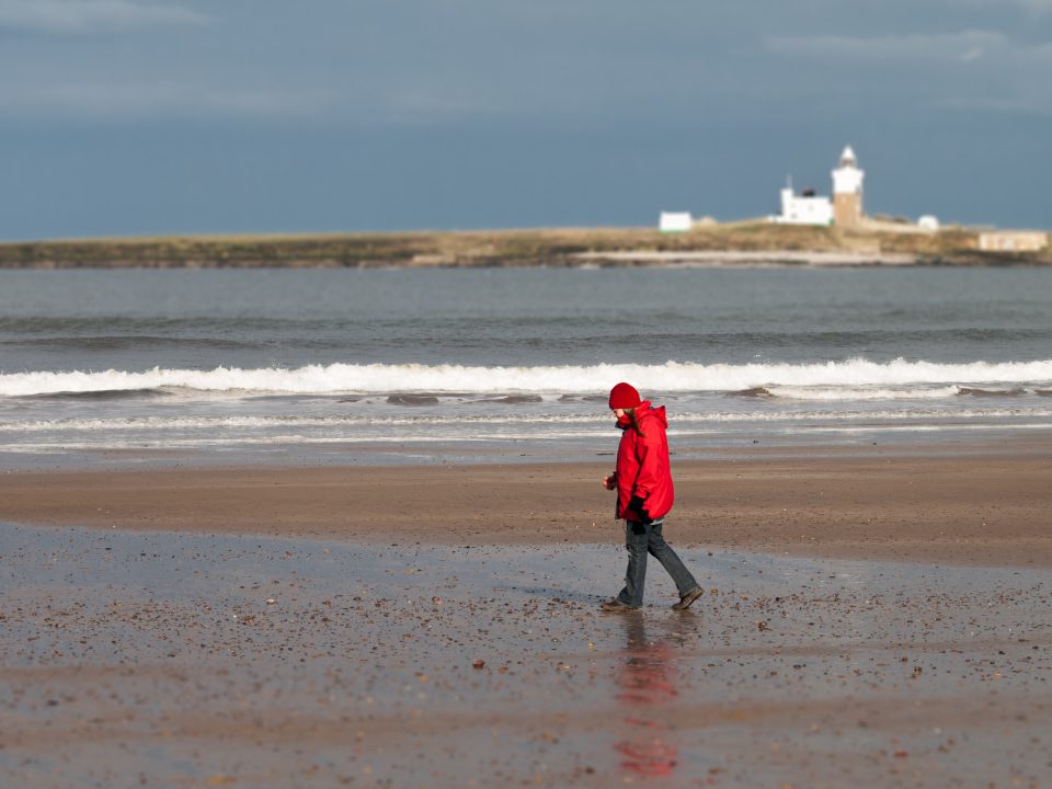 My wife walking on the beach, shot with my old Olympus E-510 in 2011