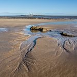 Landscape panorama picture of the beack and Coquet Island