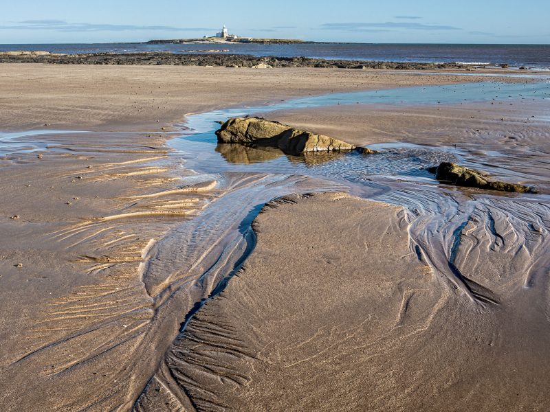 Landscape panorama picture of the beack and Coquet Island