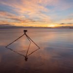 OM System camera on the beach.