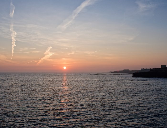 Sunrise over the sea looking South from Amble Pier.