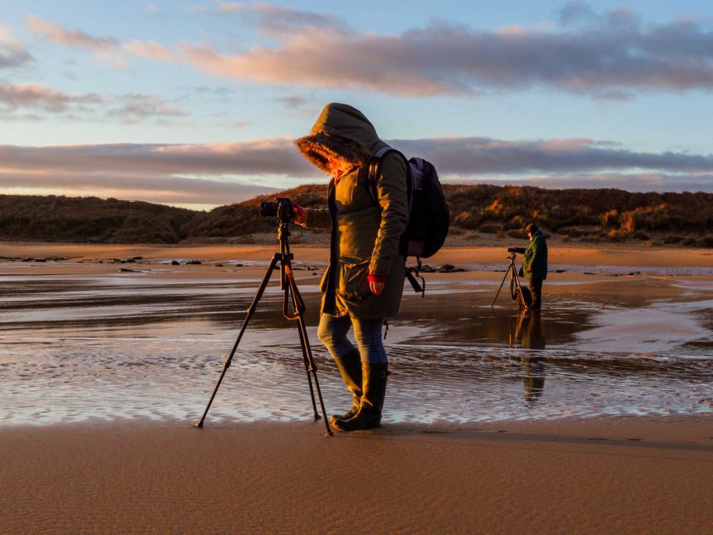 Two photographers on the beach on one of Ivor's workshops.