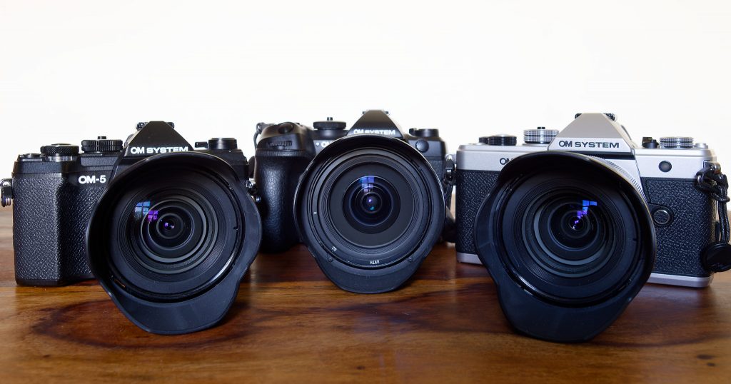 Three OM System Cameras