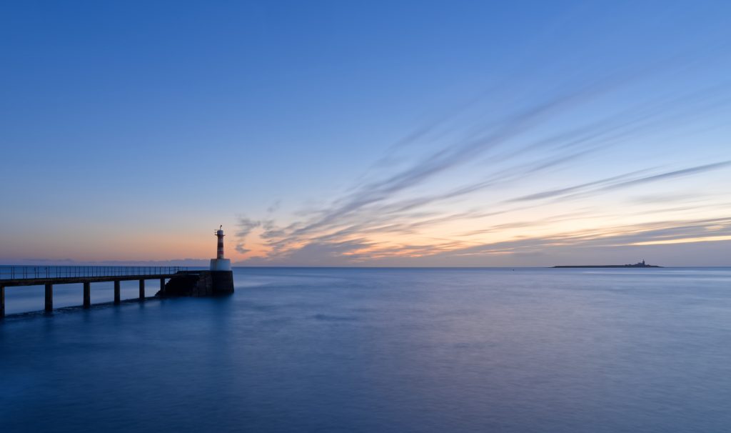 a 60 second exposure of Amble Pier and Coquet Island using an ND filter to achieve the long shutter speed.